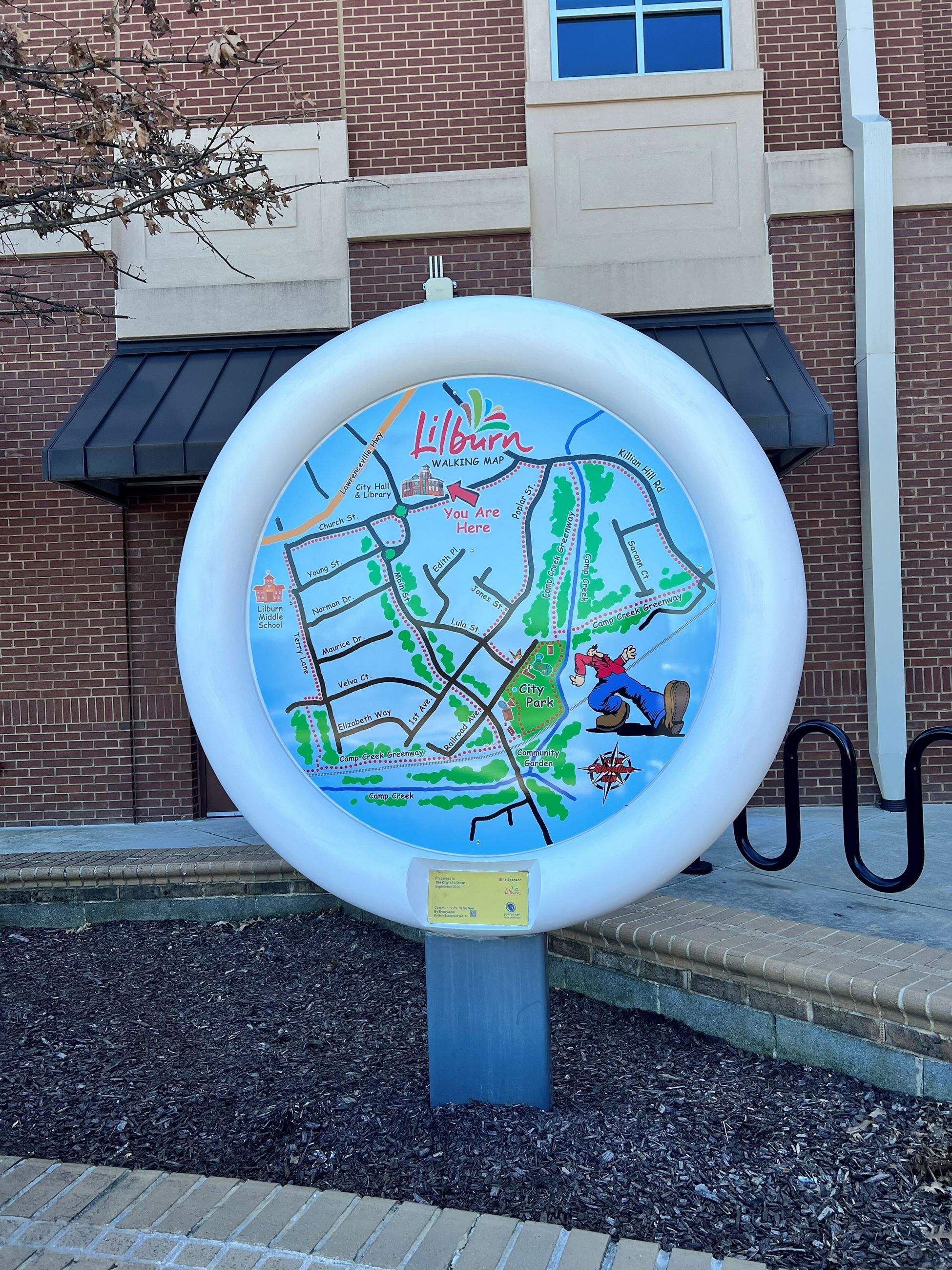 painted map on a large button sculpture