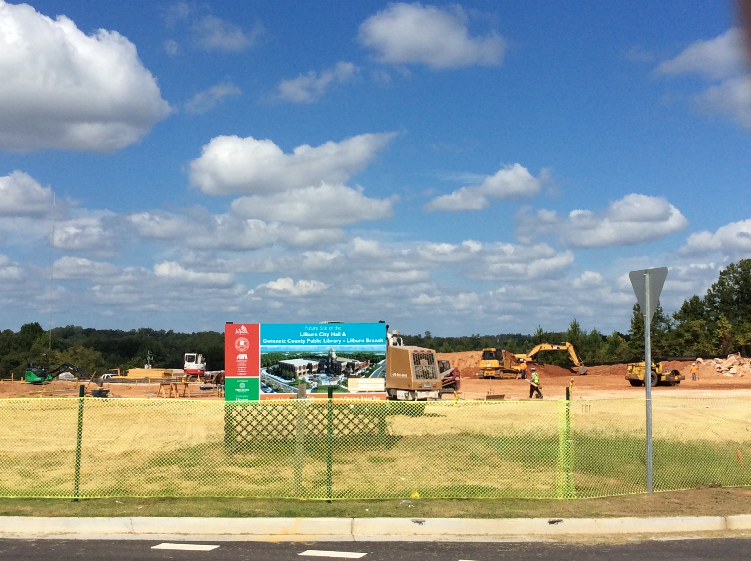 Concrete footing excavation continues.